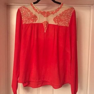 Coral colored blouse with sequin embellishment